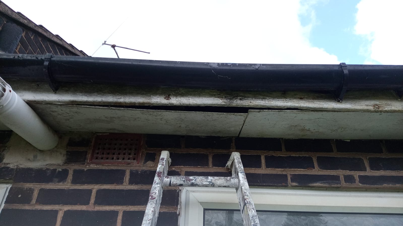 Decayed soffit and fascia before repair at Sutton Court