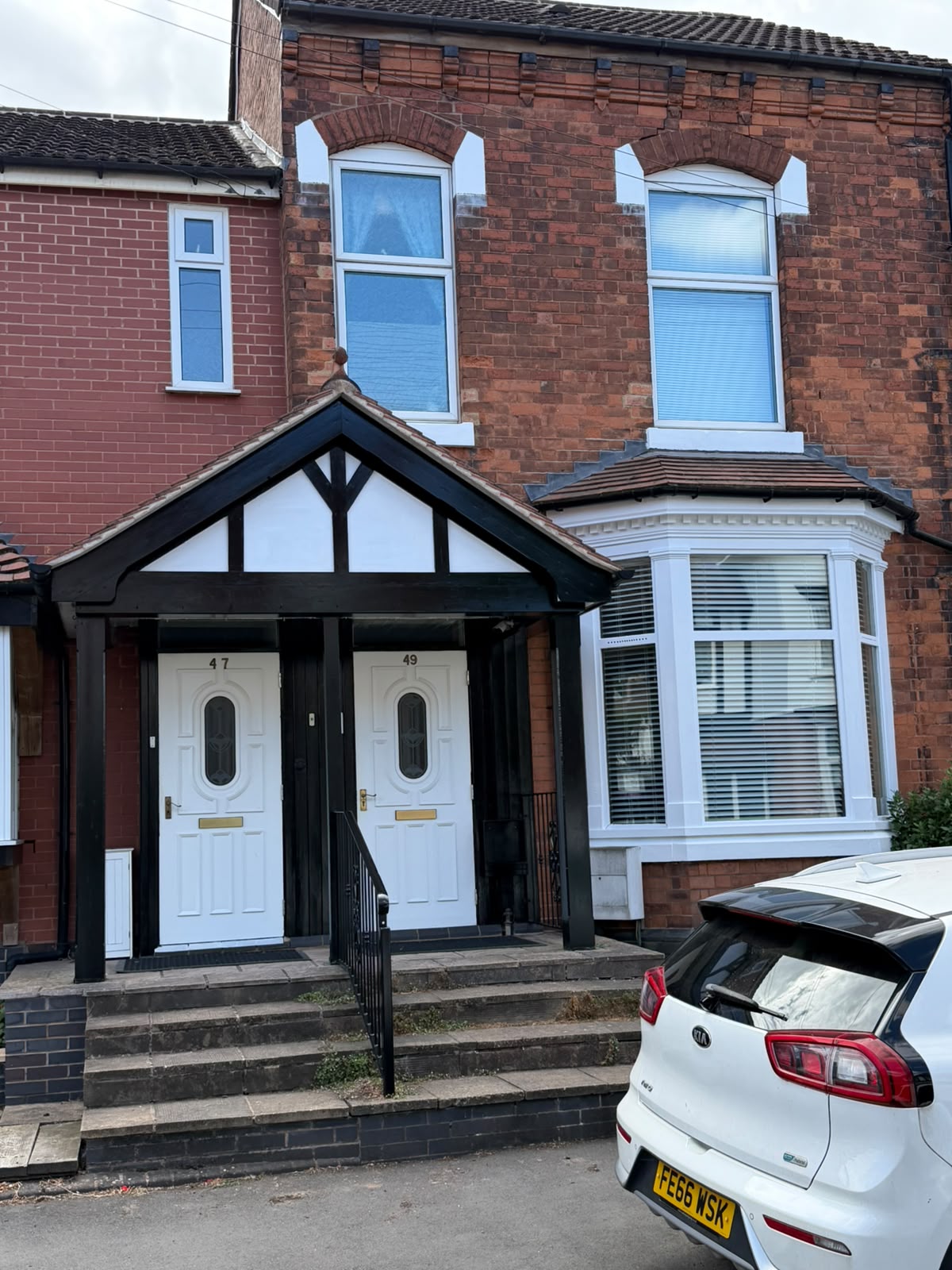 Victorian Porch & Front Doors Victorian terrace porch with black painted timber framing, white infill panels and two white front doors