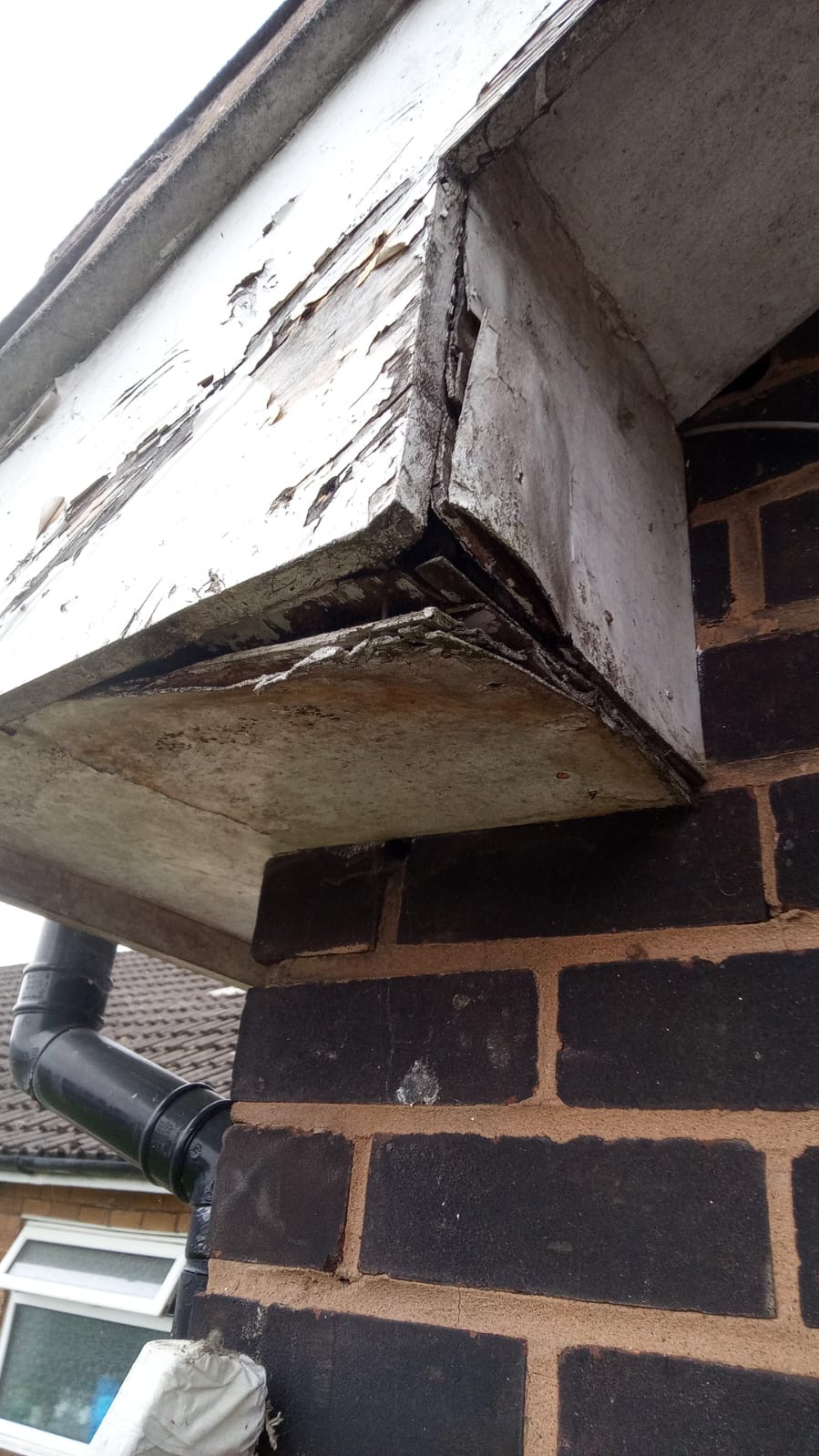 Deteriorated fascia corner before repair at Sutton Court
